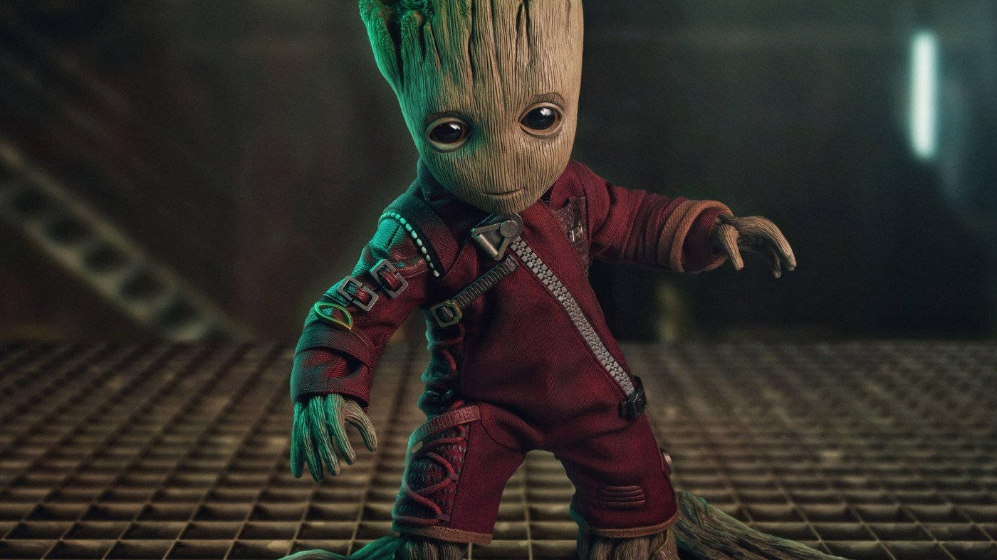 4k Guardians Of The Galaxy With Baby Groot In Red Suit Wallpaper