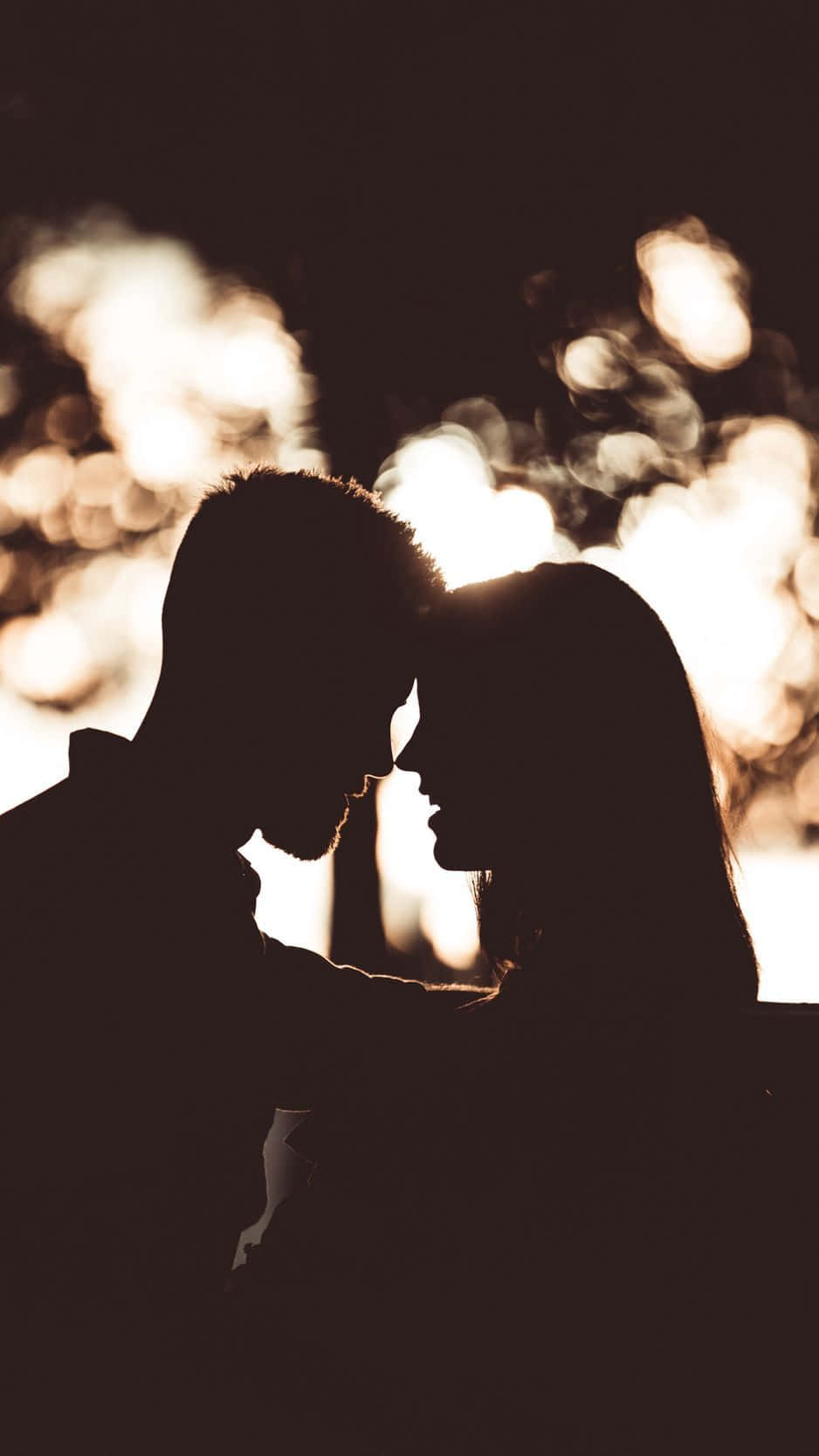 A Black Couple Enjoying A Breezy Afternoon At The Beach Wallpaper