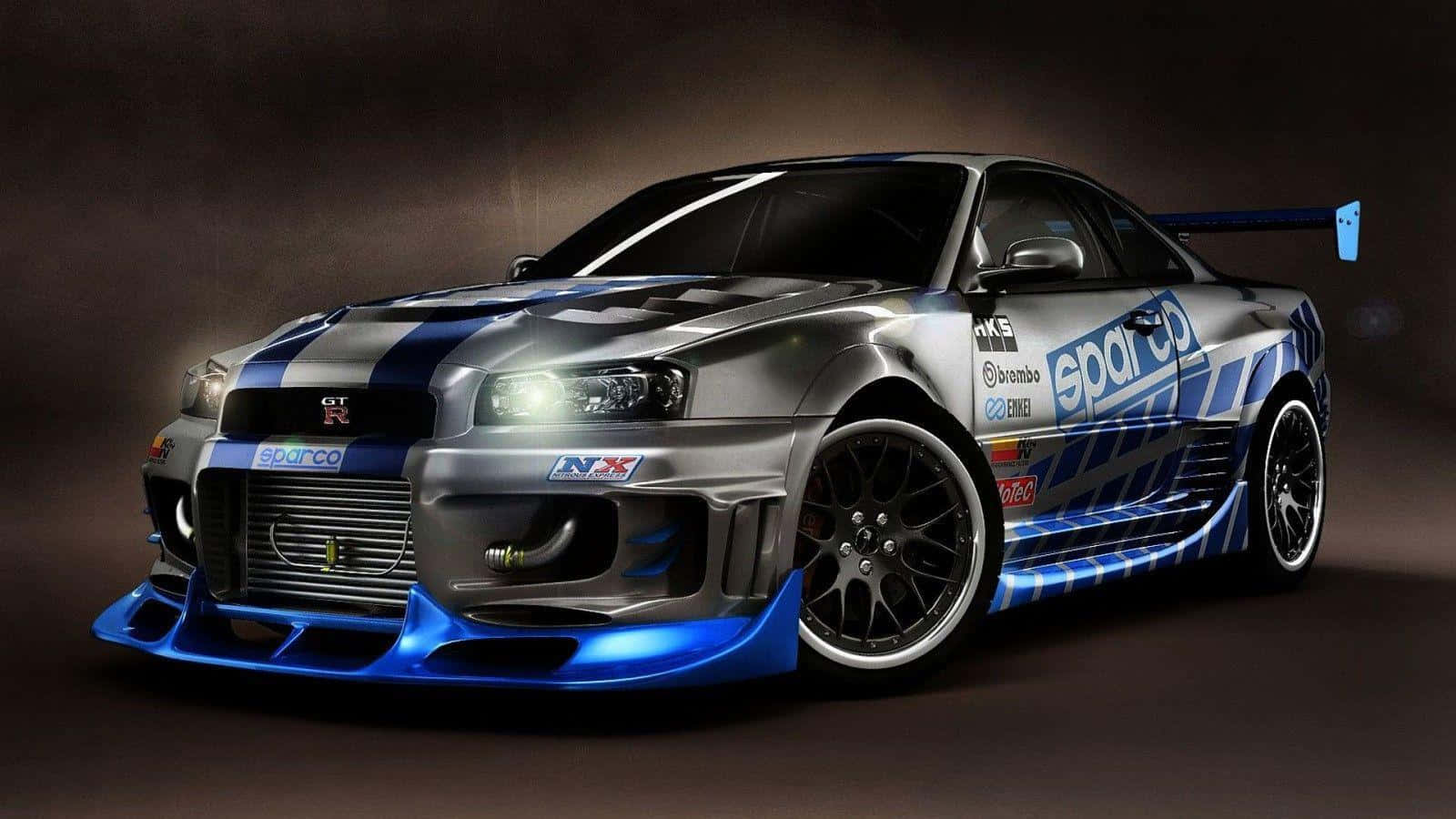 A Blue And Silver Car With Lights On It Wallpaper