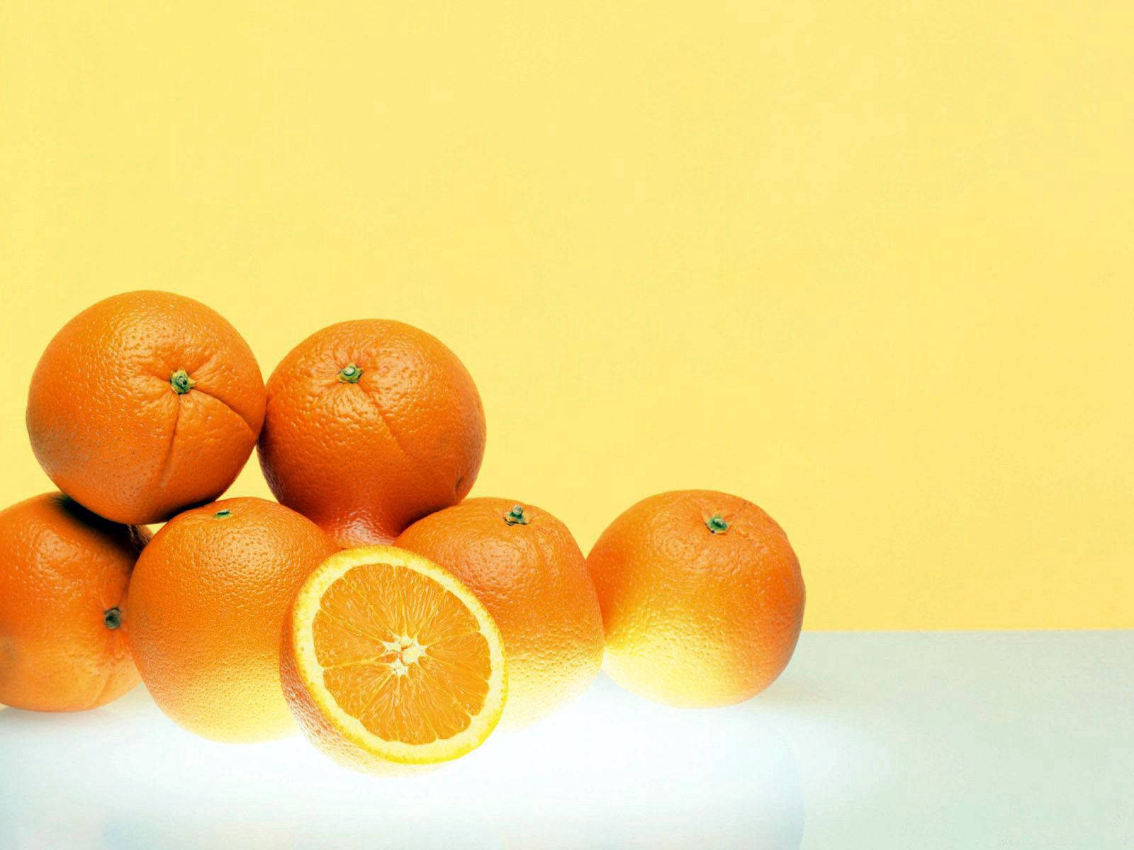 A Bowl Of Fresh Orange Fruits Wallpaper