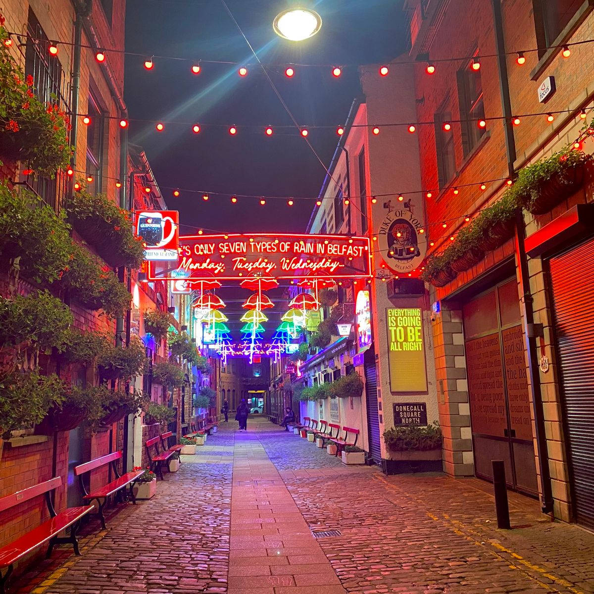 A Brick Walkway With Lights Wallpaper