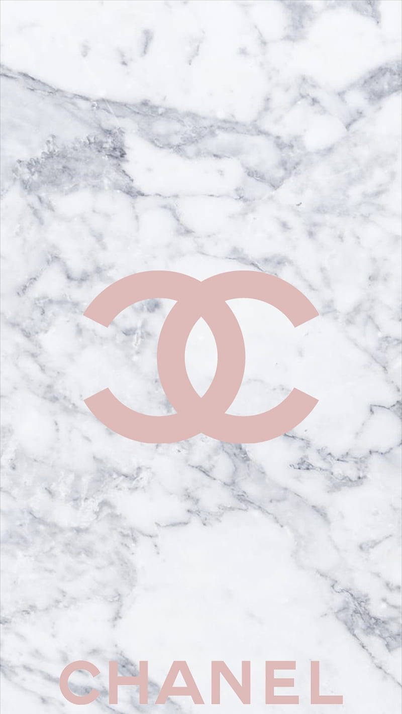 A Bright Pink Chanel Logo Against A White Background. Wallpaper