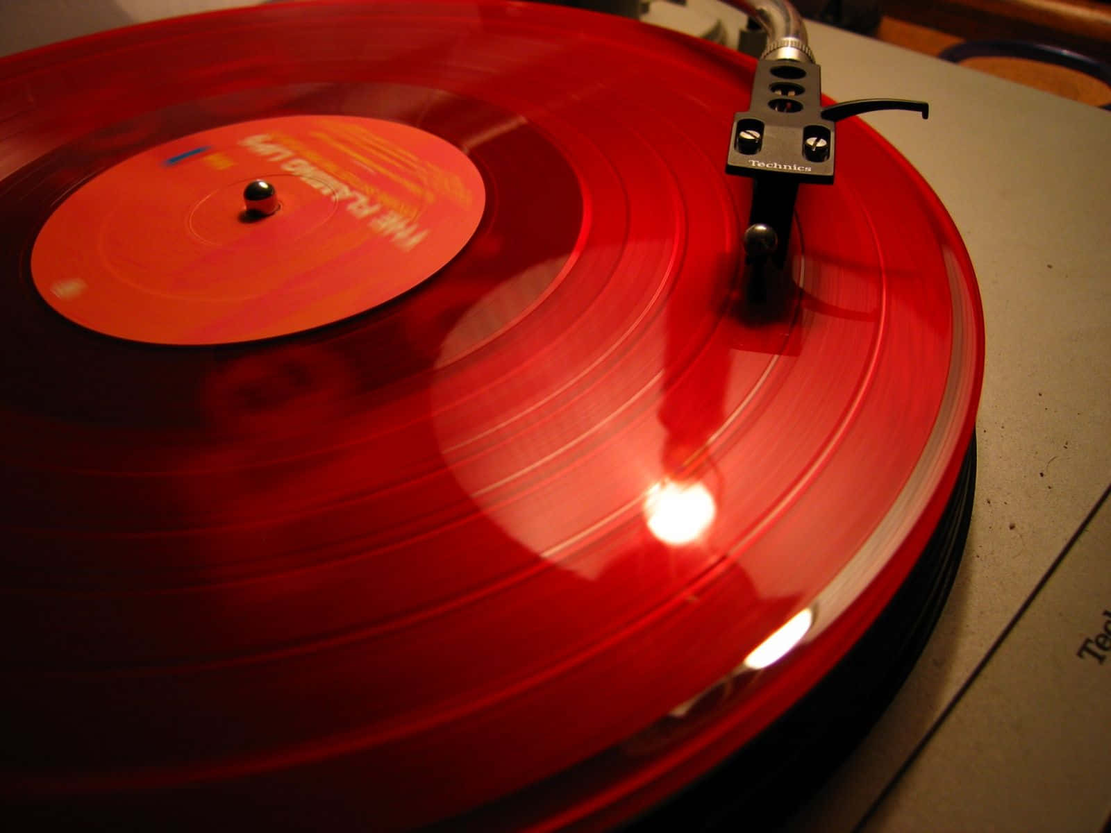 A Classic Black Vinyl Record Player Rotating A Vintage Vinyl Record Wallpaper