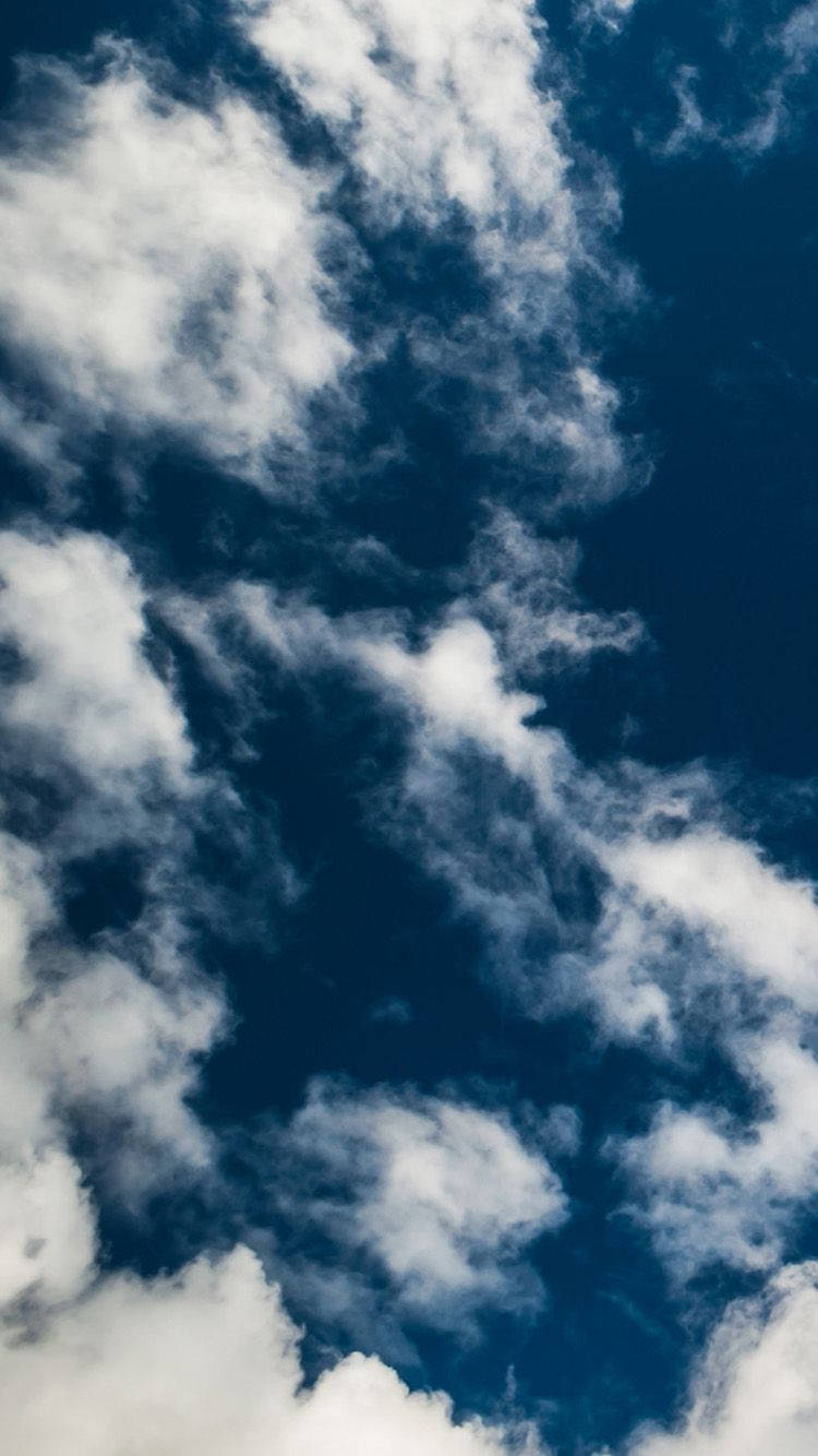 A Cloudy Sky From The Heights Of Iphone Wallpaper