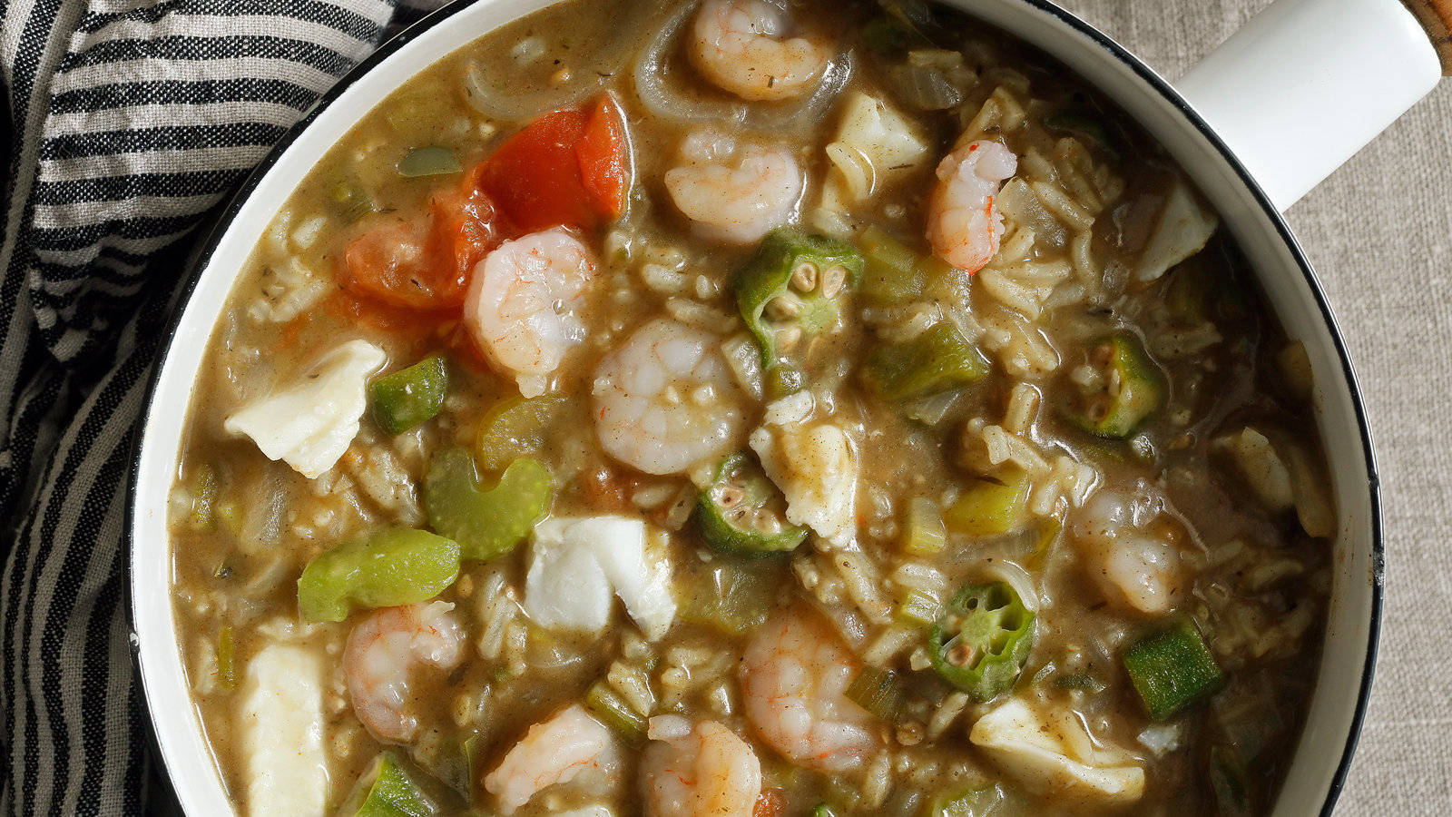 A Delectable Bowl Of Gumbo With Shrimp And Vegetables Wallpaper