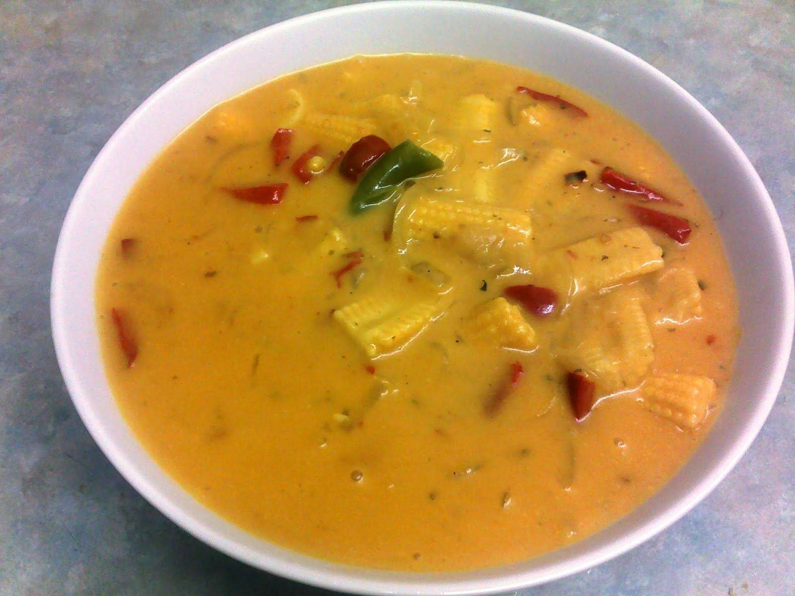 A Delightful Dish Of Yellow Curry With Fresh Baby Corn Wallpaper