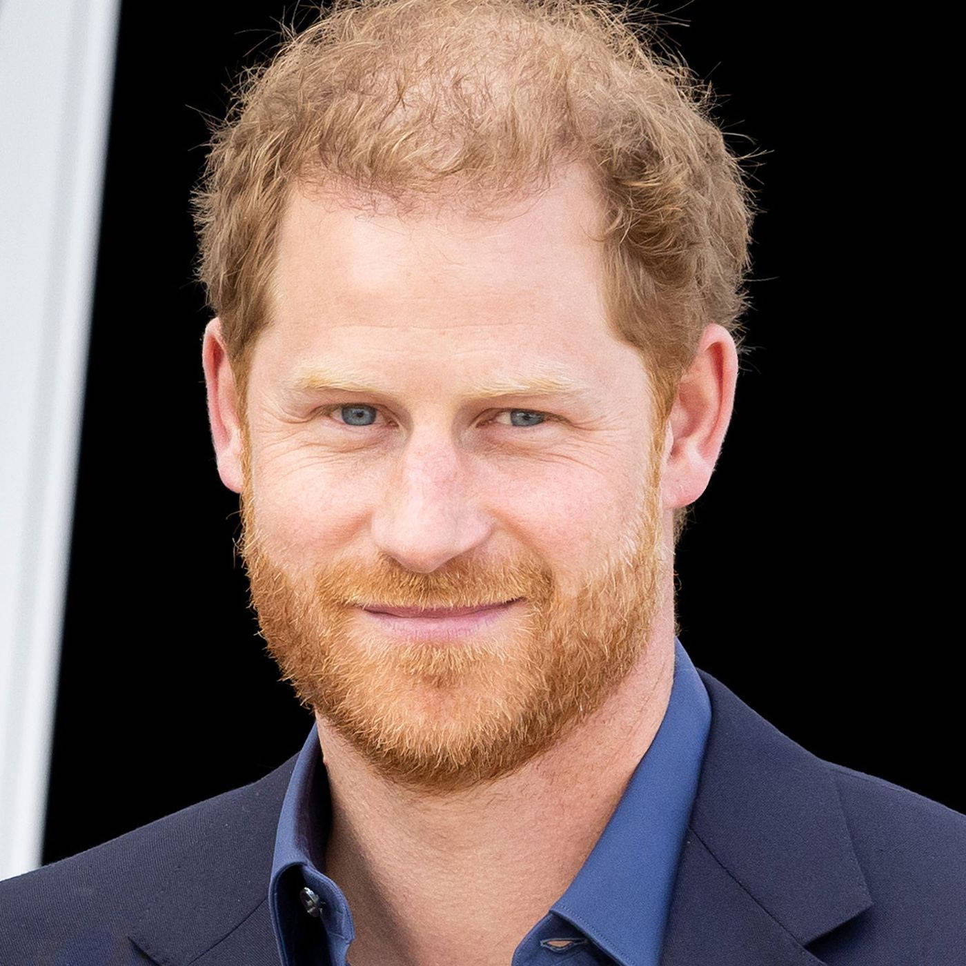 A Genuine And Heartwarming Smile From Prince Harry Wallpaper