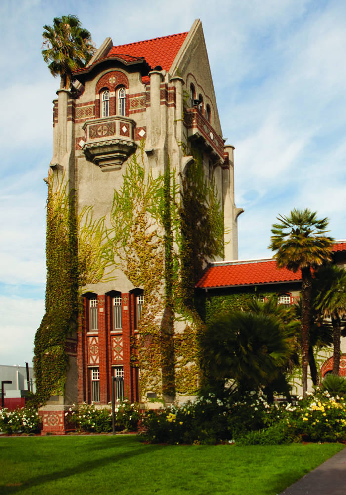 A Large Building With A Clock Tower Wallpaper