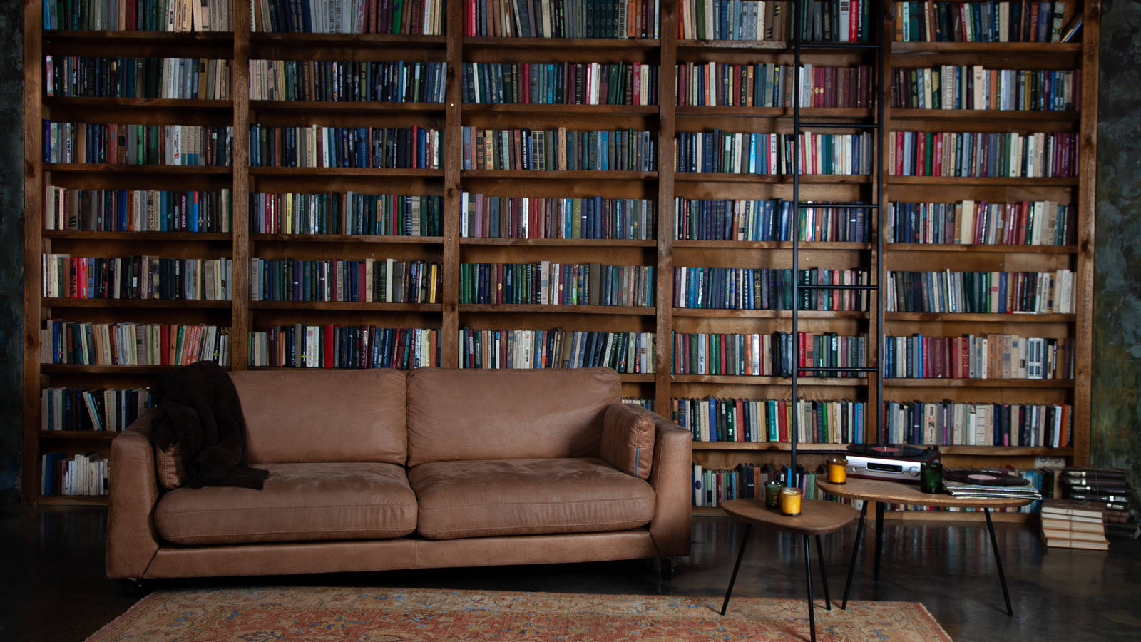 A Large Room Filled With A Grand Bookshelf Wallpaper