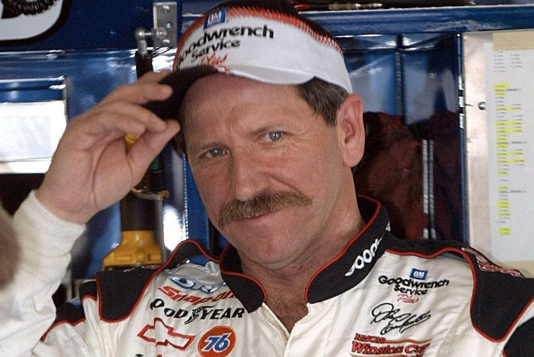 A Man In A Nascar Uniform With A Mustache Wallpaper