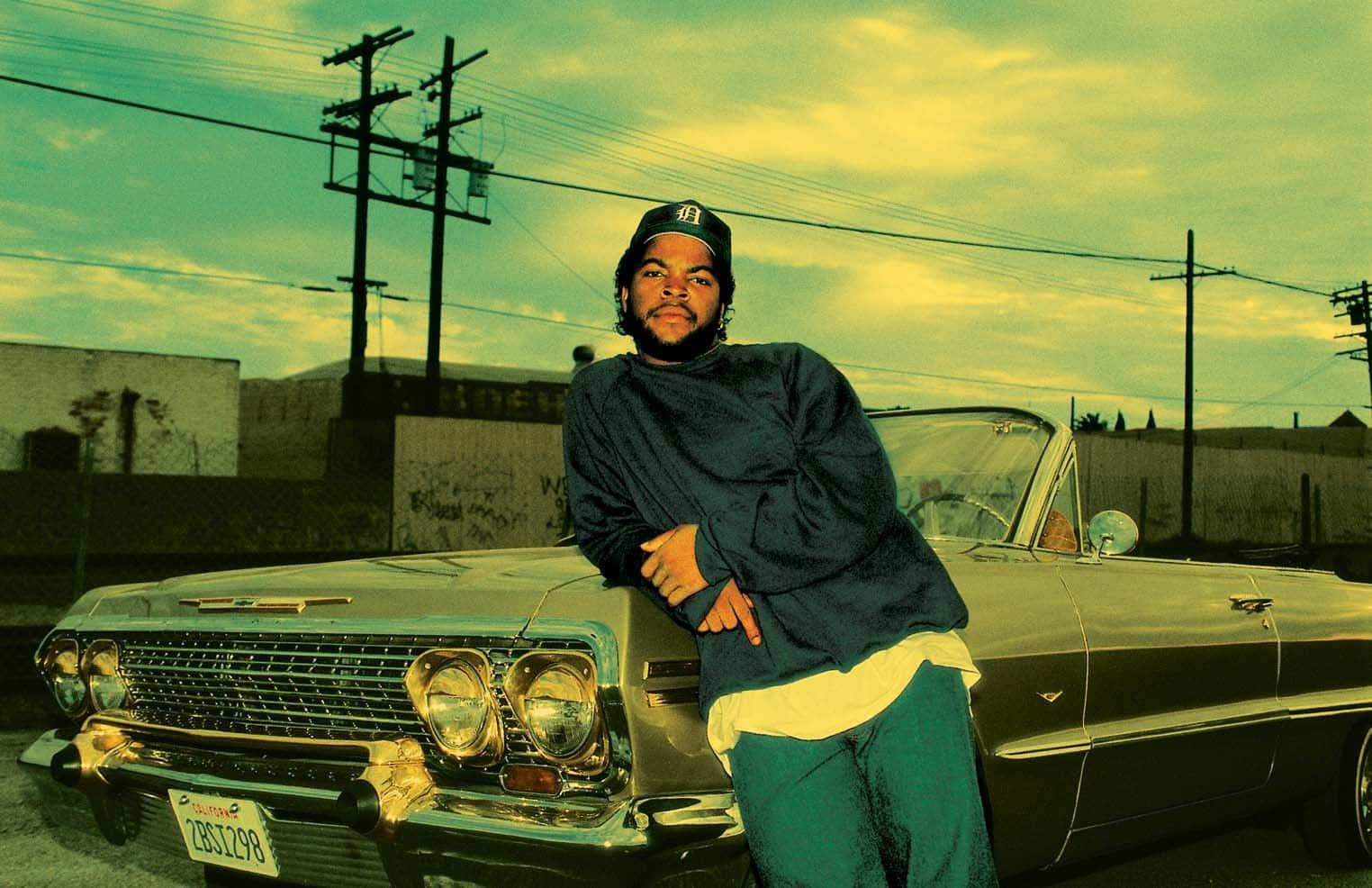 A Man Is Standing Next To A Classic Car Wallpaper