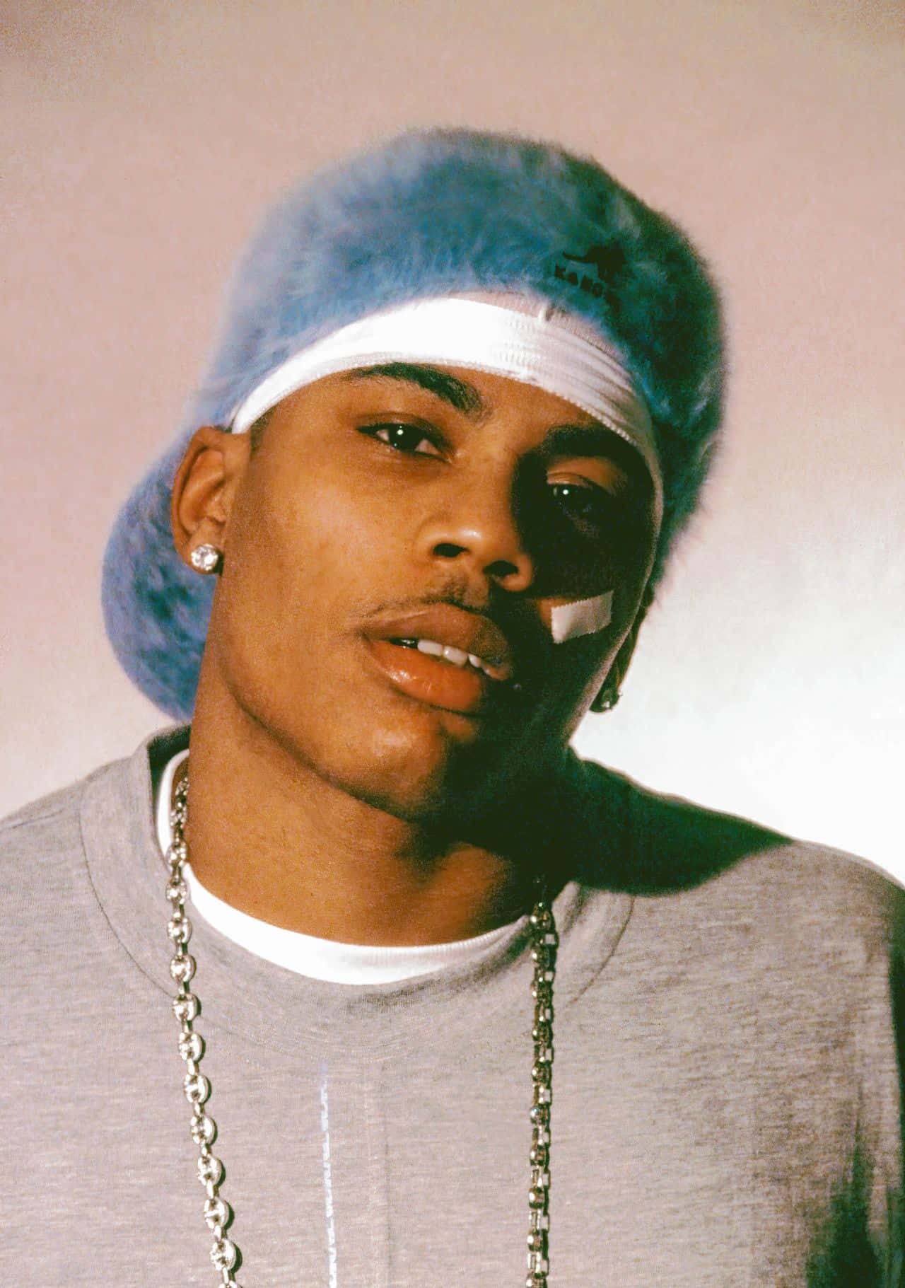 A Man Wearing A Blue Hat Wallpaper