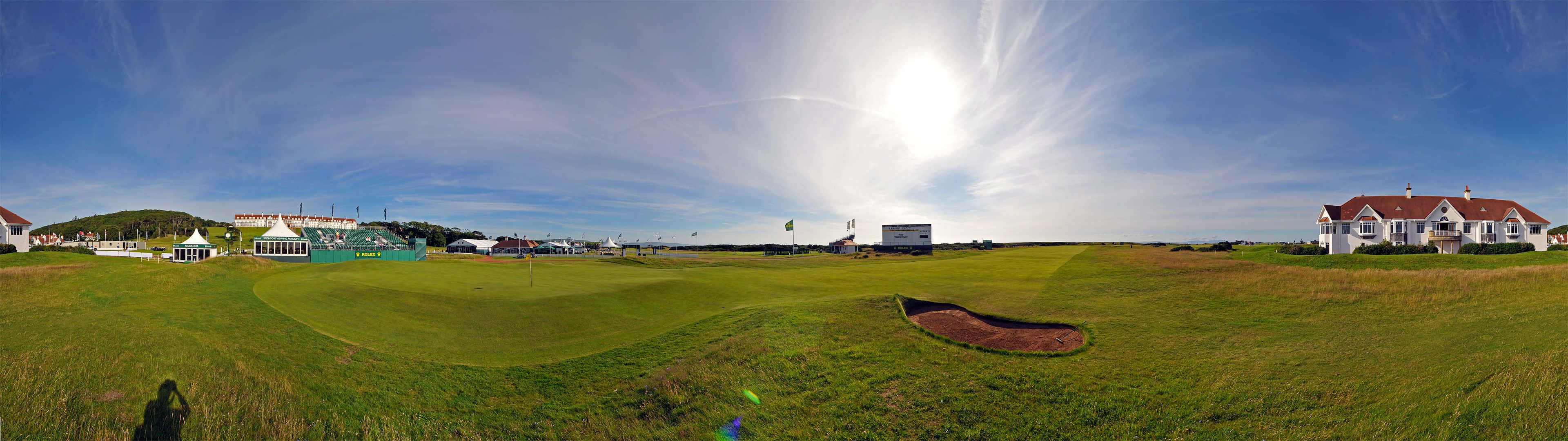 A Professional Golfer Practices His Technique On The Green. Wallpaper