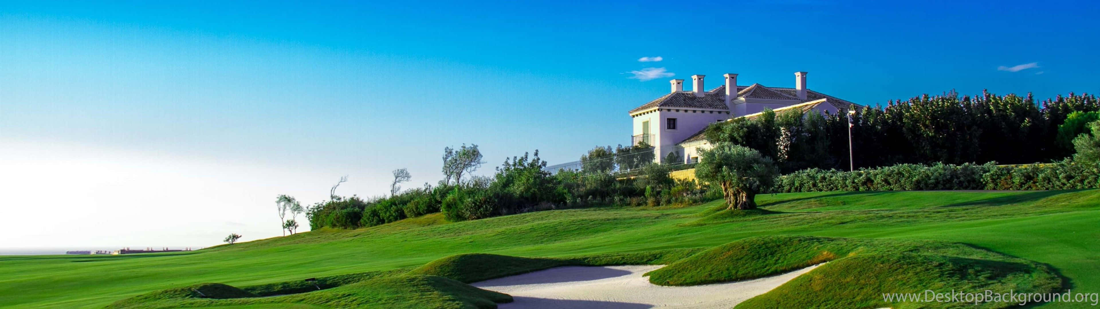 A Professional Taking Aim In A Golf Course Wallpaper