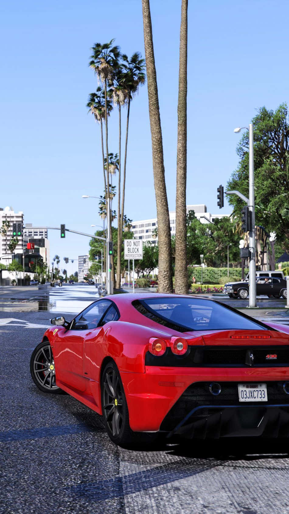 A Red Ferrari Sports Car Driving Down The Street Wallpaper