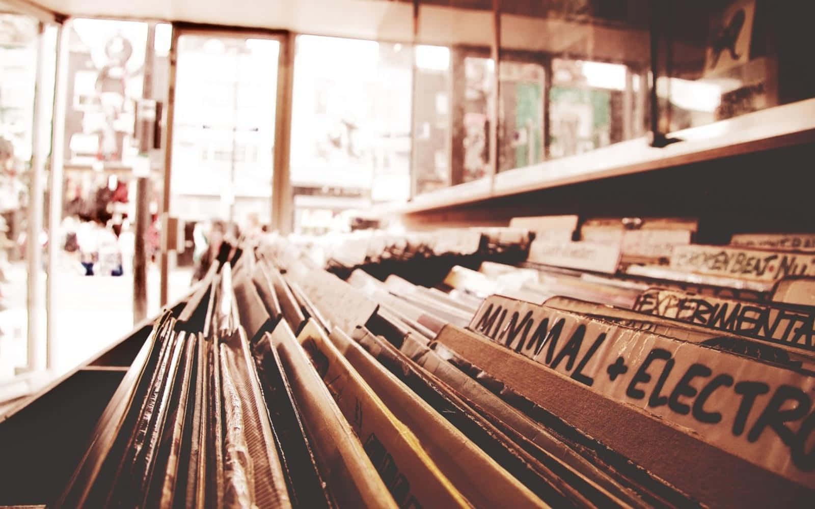 A Row Of Records In A Store Wallpaper