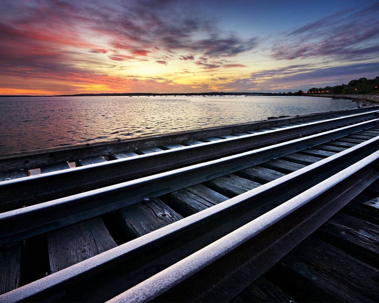 A Rustic Rail Crossing At Sundown Wallpaper