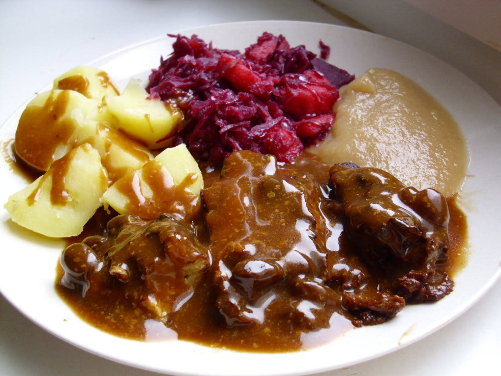 A Savory Delight Of Sauerbraten - Traditional German Dish Wallpaper