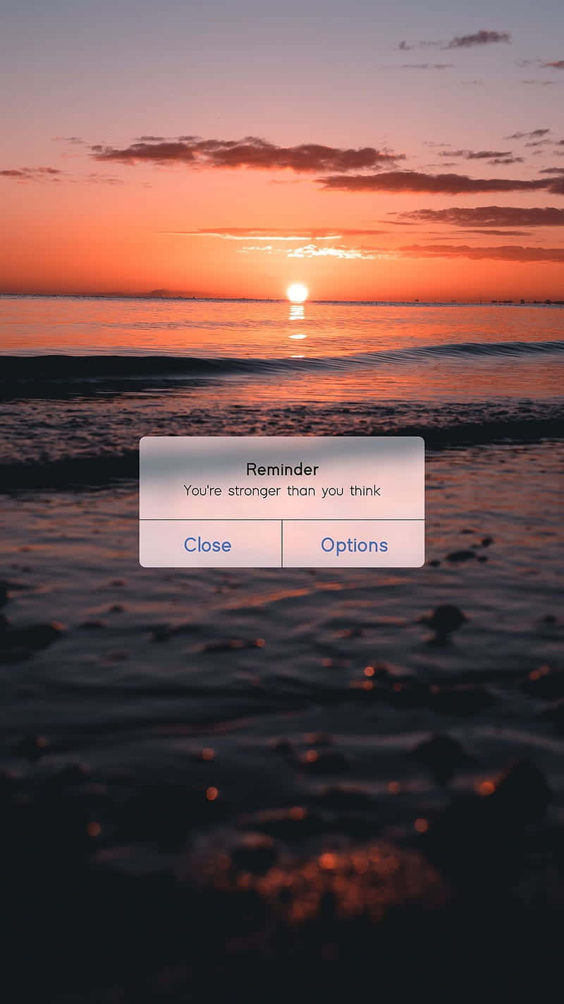 A Screenshot Of The Sunset On The Beach Wallpaper