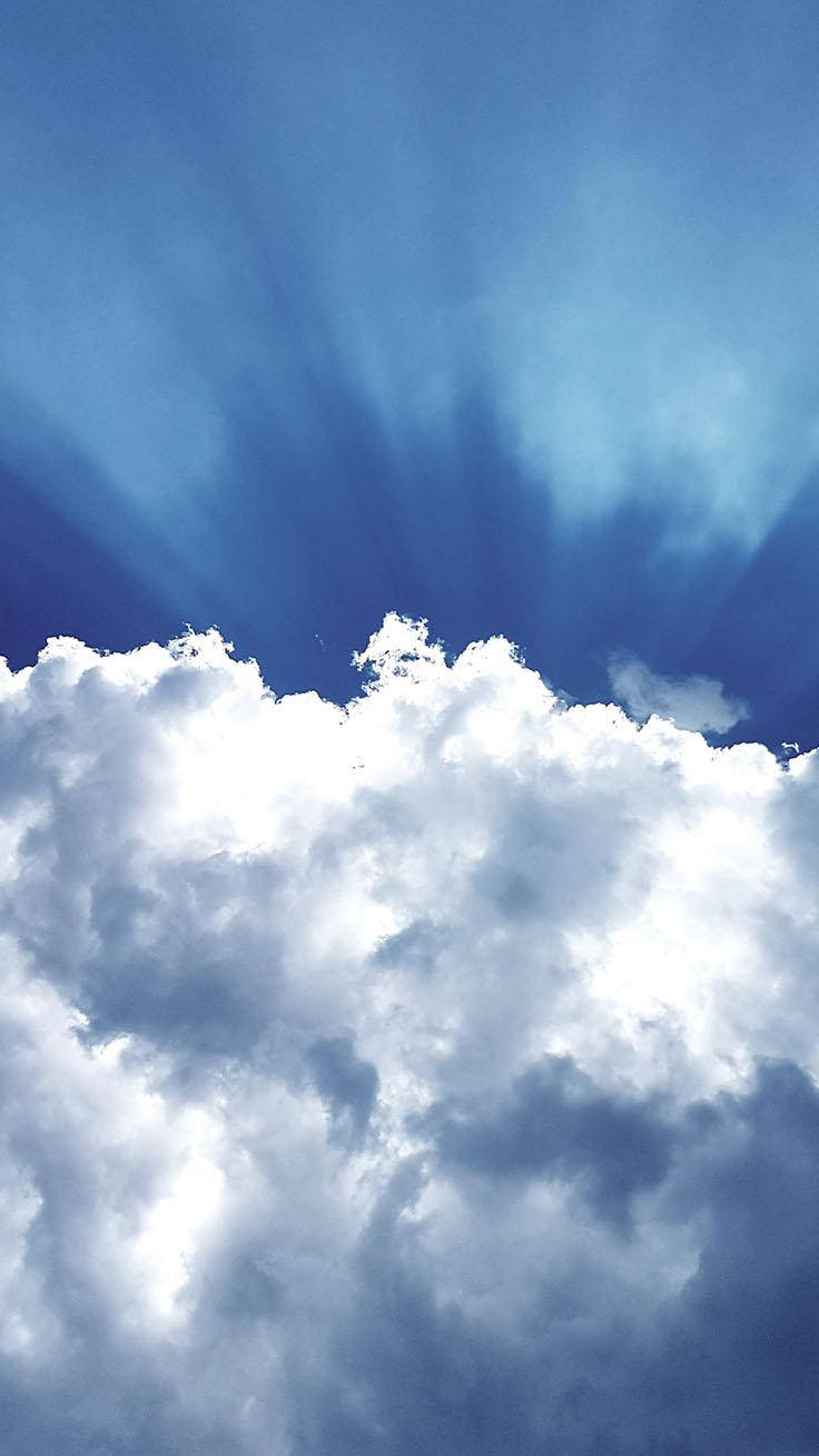 A Shimmering Light Blue Phone Against A Sky Backdrop Wallpaper