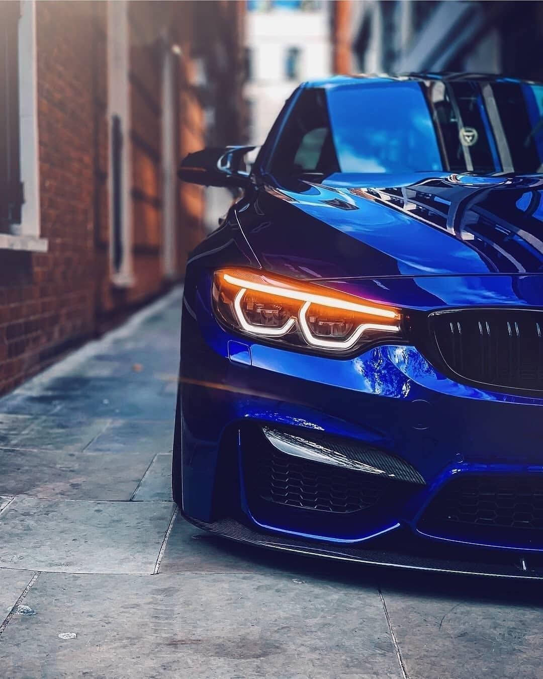 A Sleek Bmw In The Cityscape, With Skyline In The Backdrop. Wallpaper