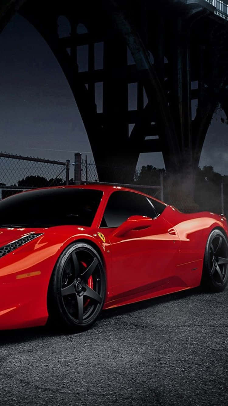 A Sleek Red Car Parked Beside An Iphone Wallpaper