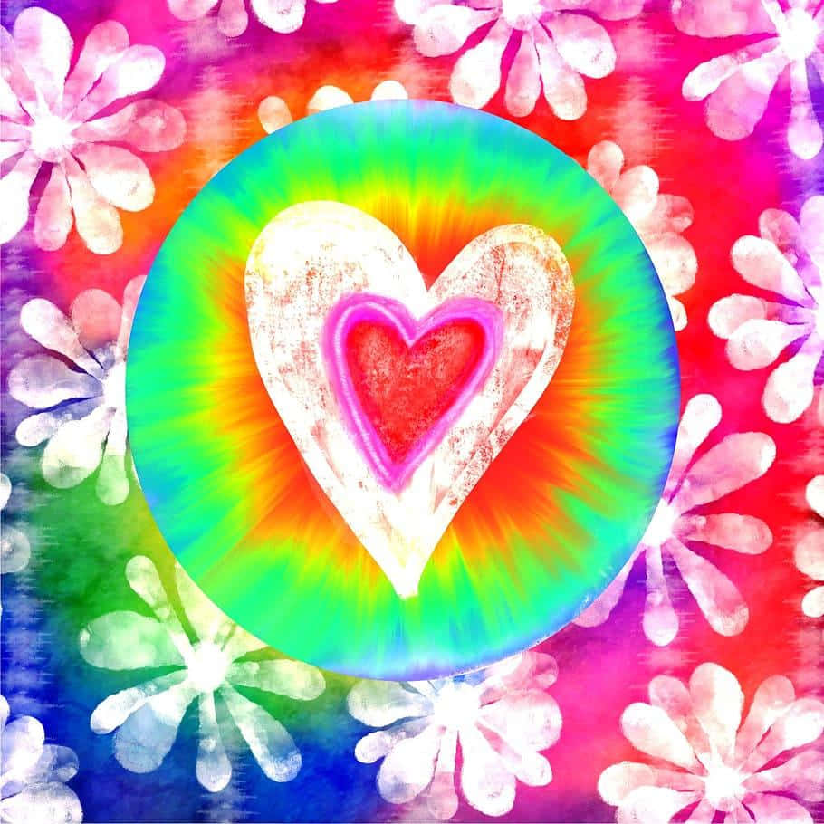 A Tie Dye Heart With Flowers On It Wallpaper