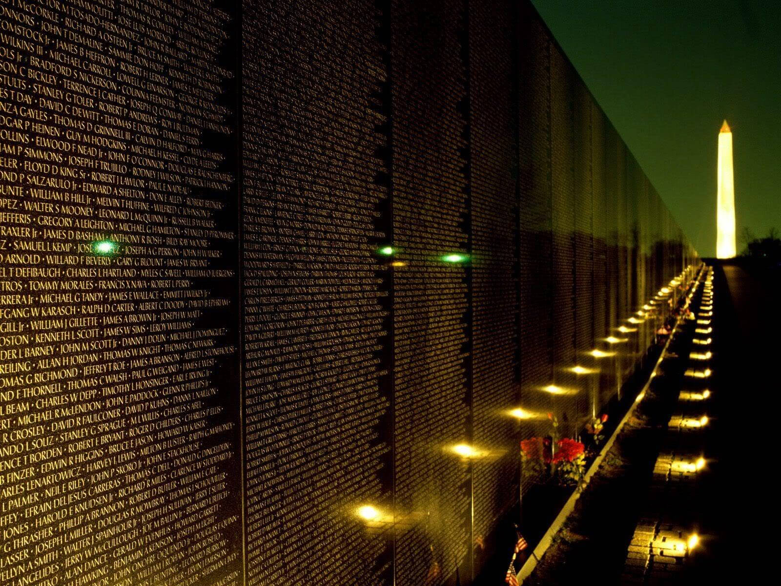 A Veteran Pays His Respects At The Vietnam Veterans Memorial During A Memorial Day Ceremony. Wallpaper