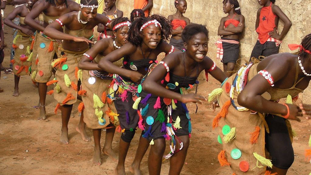 A Vibrant Display Of Traditional Dance In Guinea-bissau Wallpaper