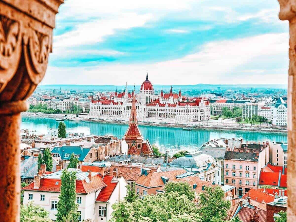 A View Of The City From An Archway Wallpaper