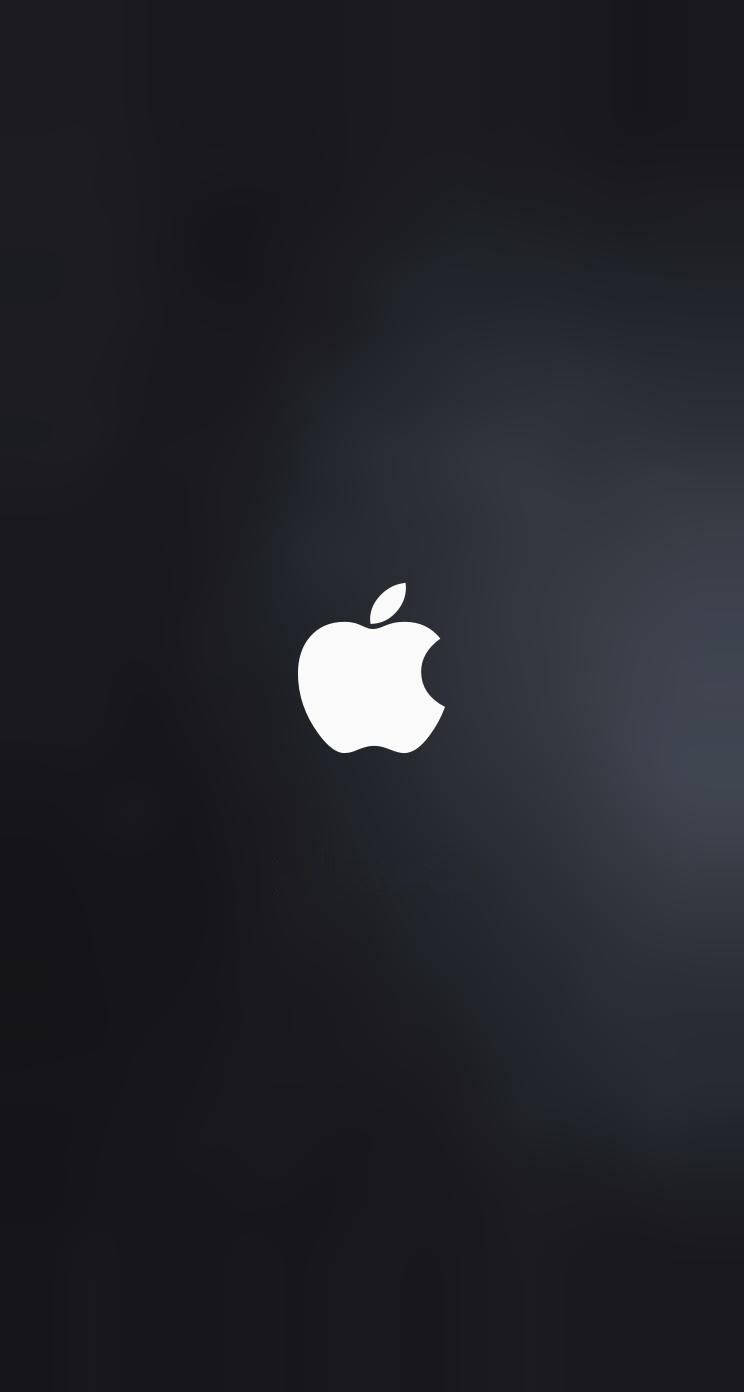 A Vivid White Apple Logo On A Dark Gray Background Wallpaper