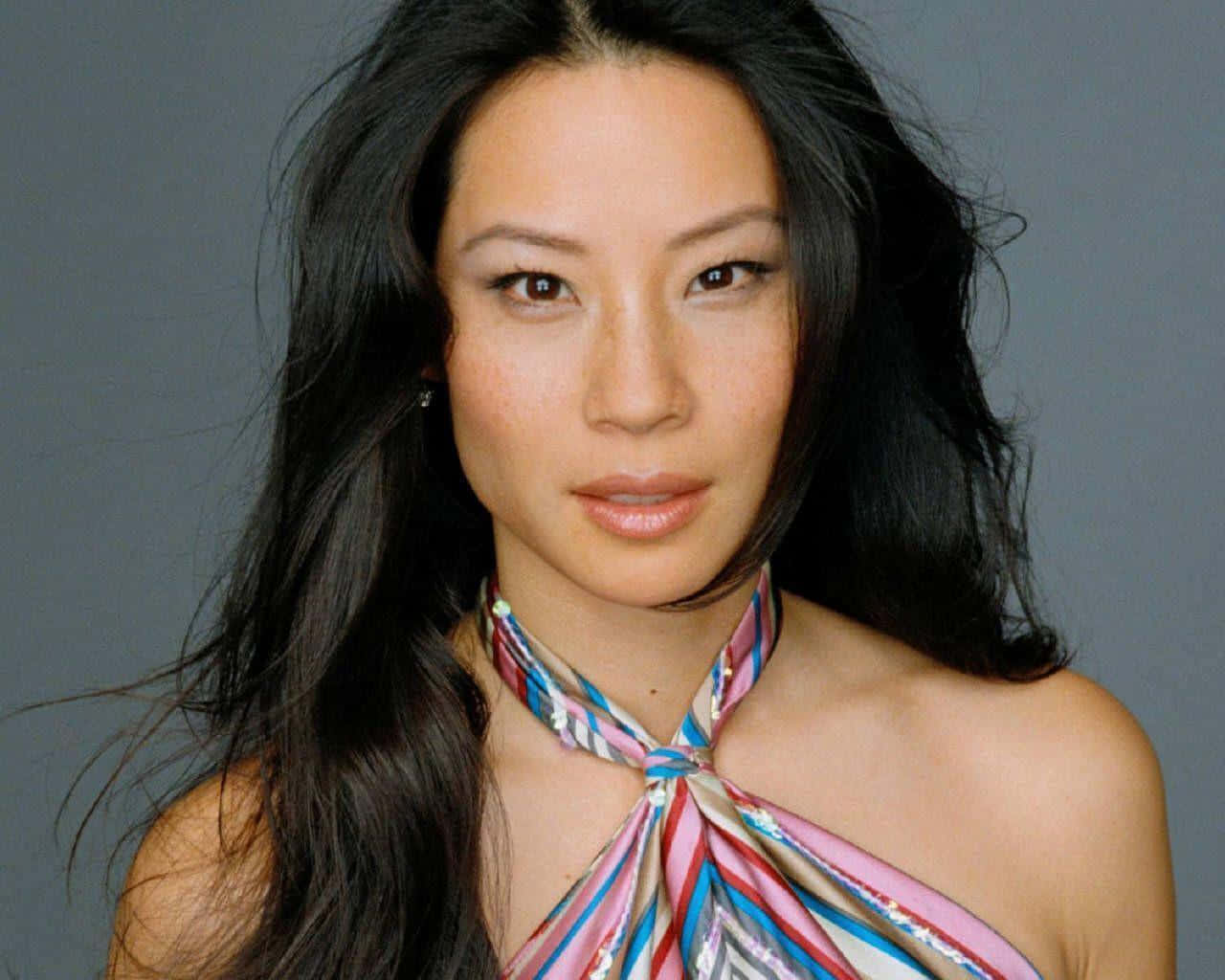 A Woman In A Colorful Dress Posing For A Photo Wallpaper