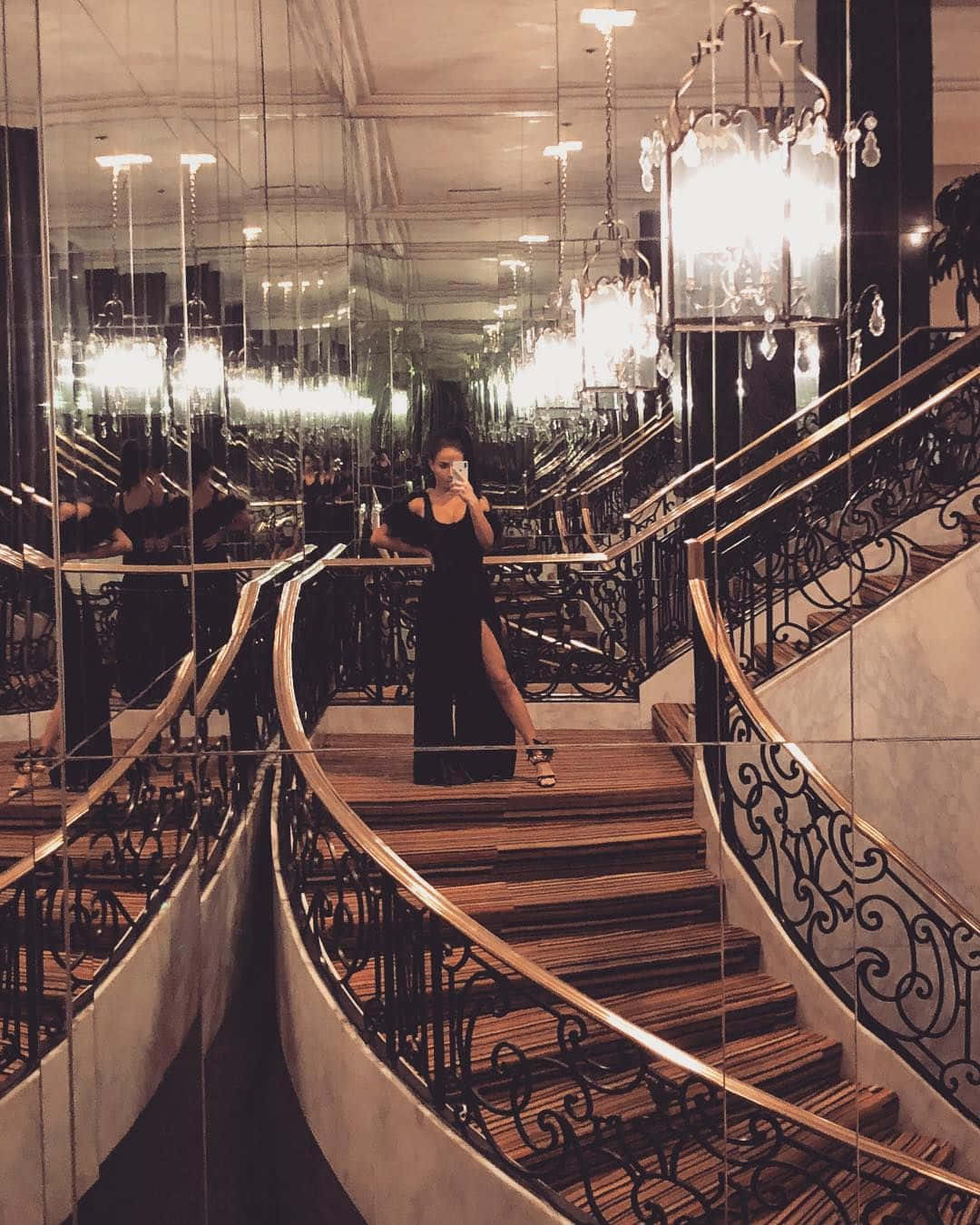 A Woman Standing On A Staircase Wallpaper