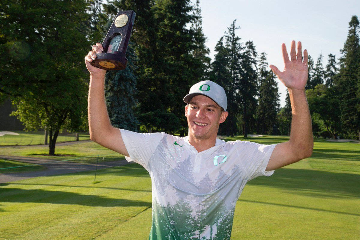 Aaron Wise Holding An Award Wallpaper