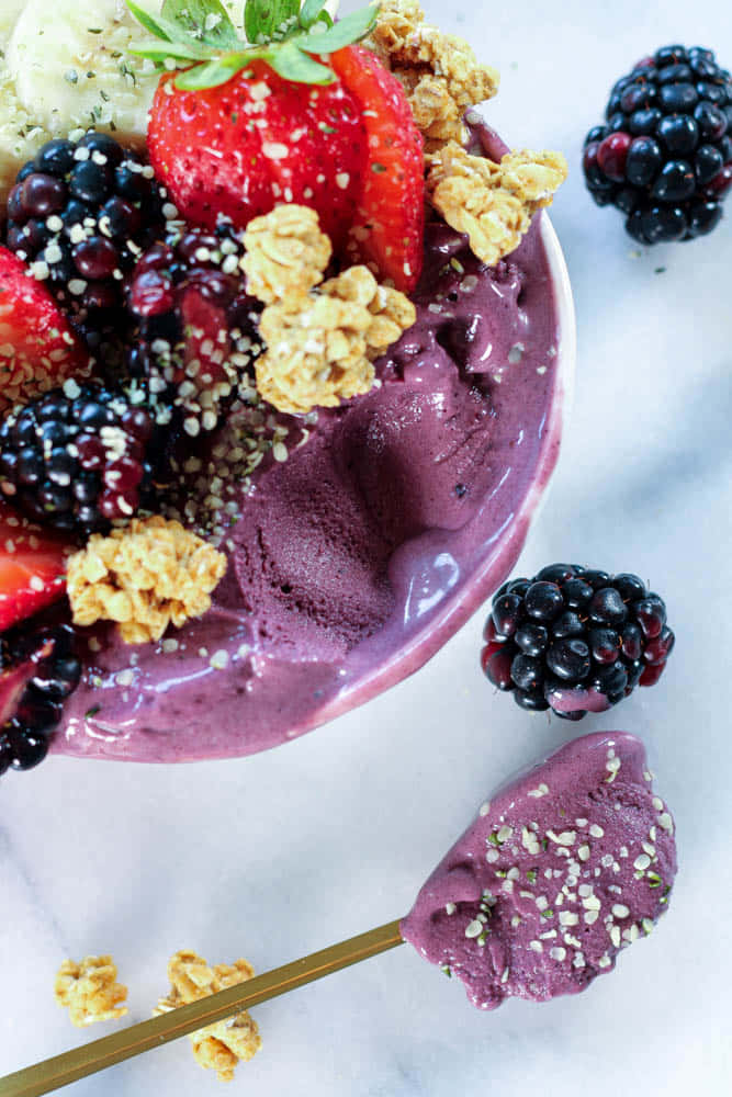 Acai Bowl With Fresh Berries And Granola Wallpaper