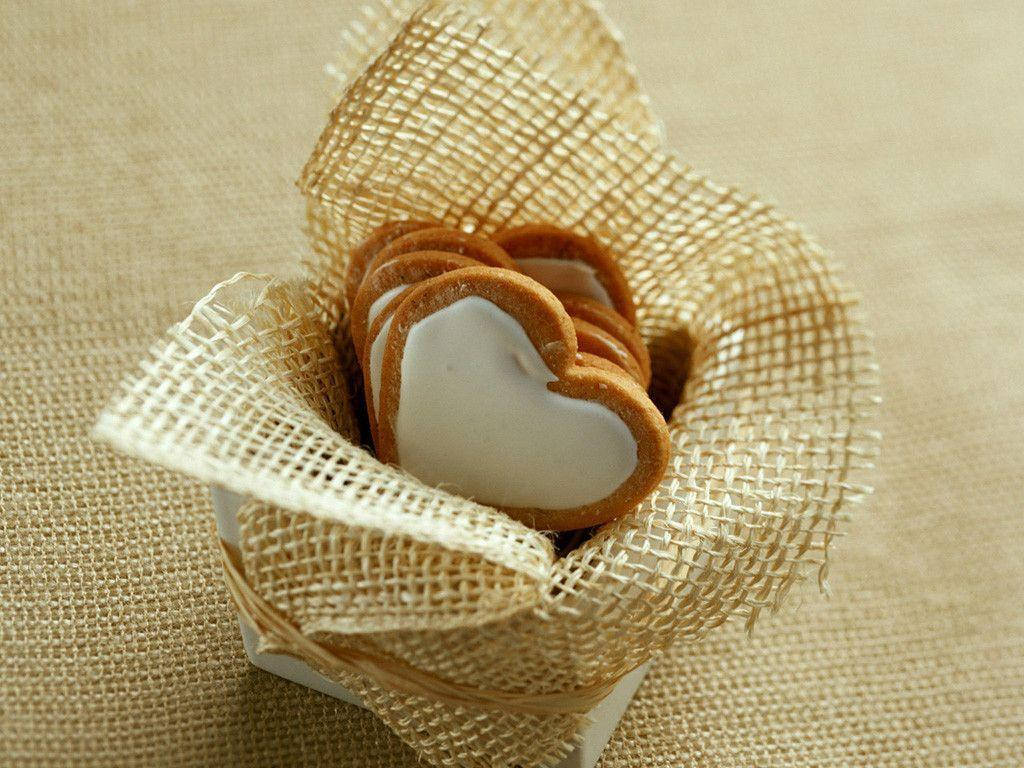 Adorable Heart-shaped Cookies Nestled In A Basket Wallpaper