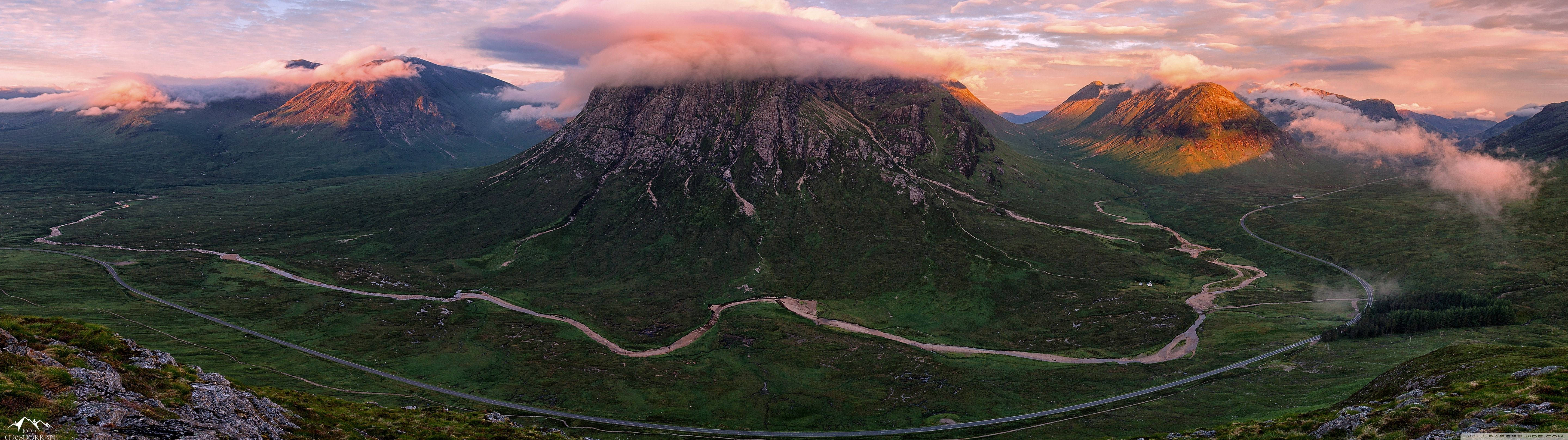 Aerial View Of A Cloud-covered Mountain Wallpaper