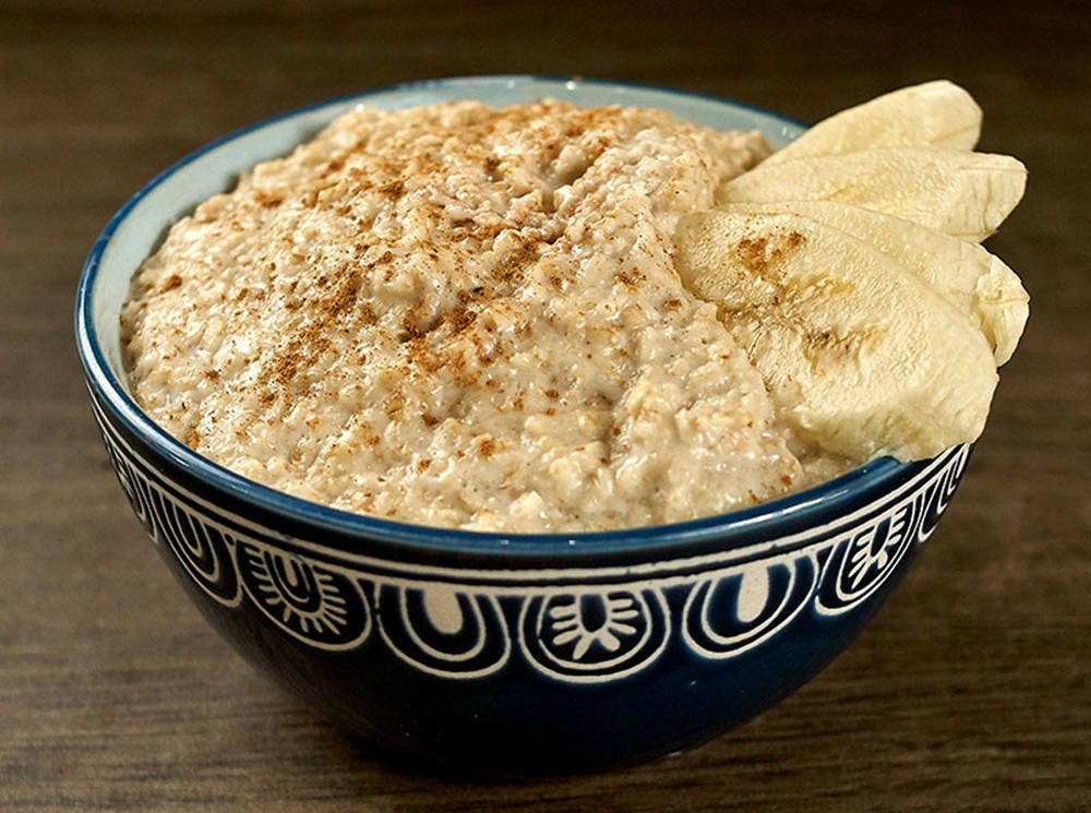 Aesthetic Bowl Of Oatmeal With Bananas Wallpaper