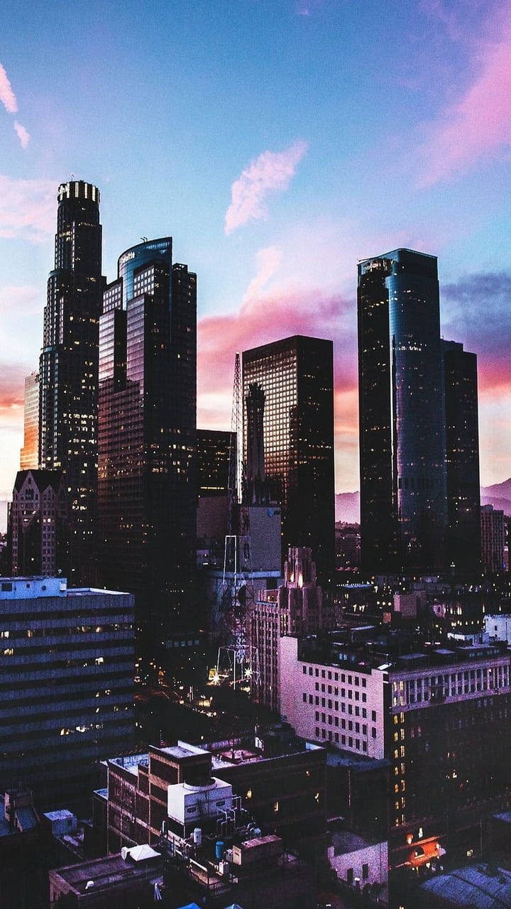 Aesthetic City Under Vivid Retro Sky Wallpaper