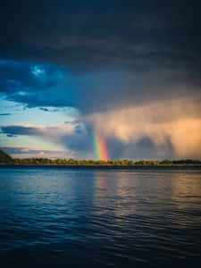 Aesthetic Rainbow Mobile Shrouded In Clouds Wallpaper