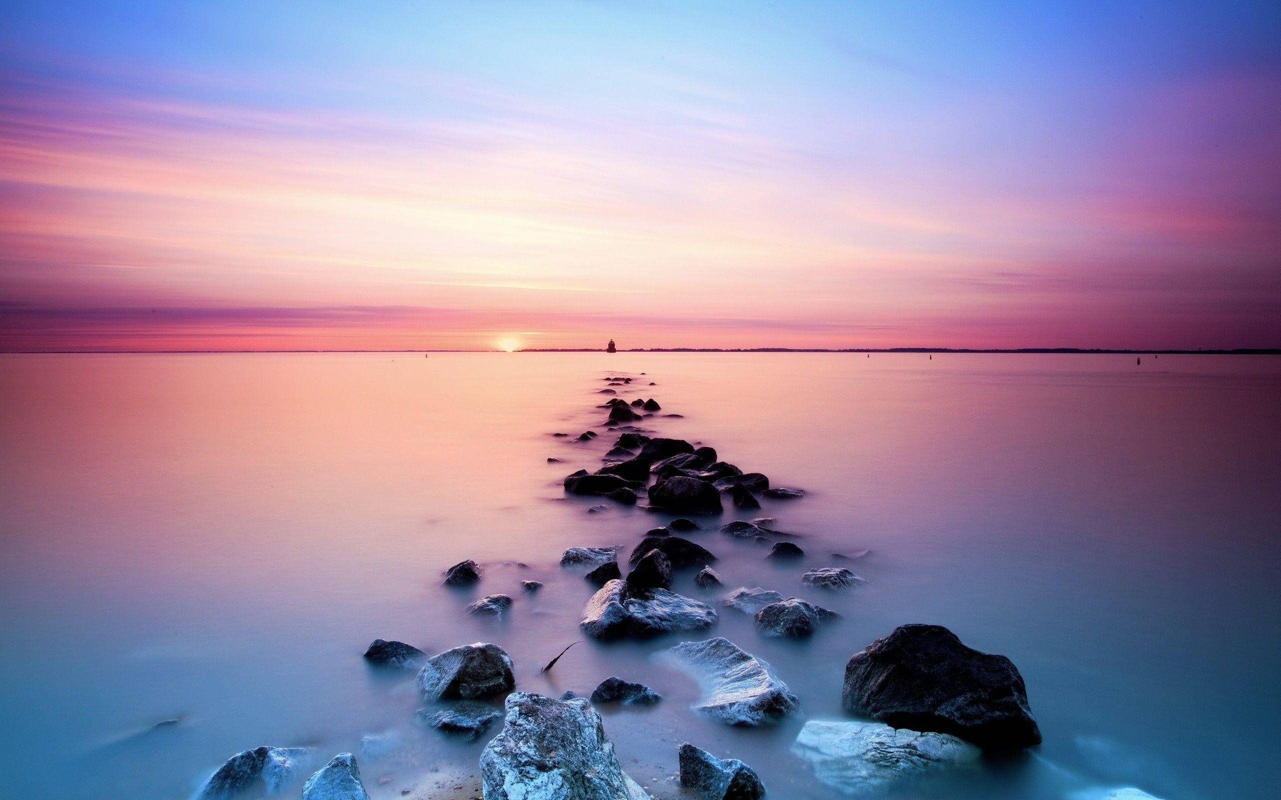 Aesthetic Sunset Rocky Shore Pathway Wallpaper