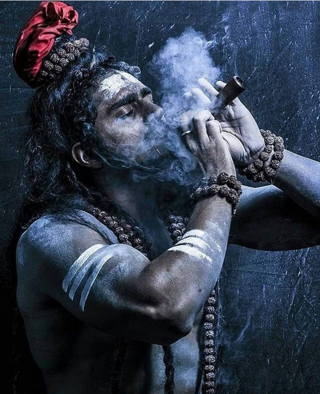 Aghori Smoking In Cave Wallpaper