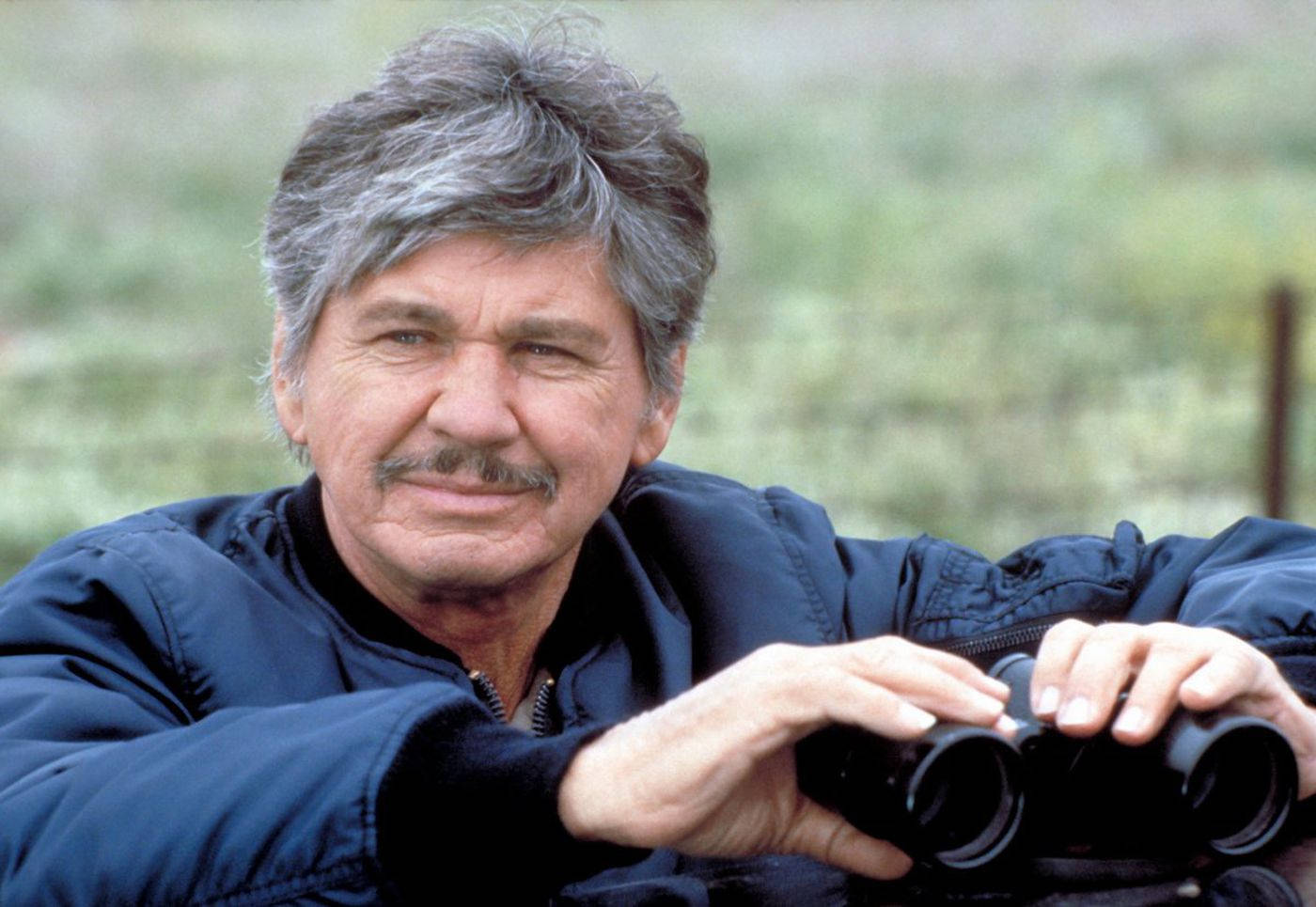 American Actor Charles Bronson With Binoculars Wallpaper