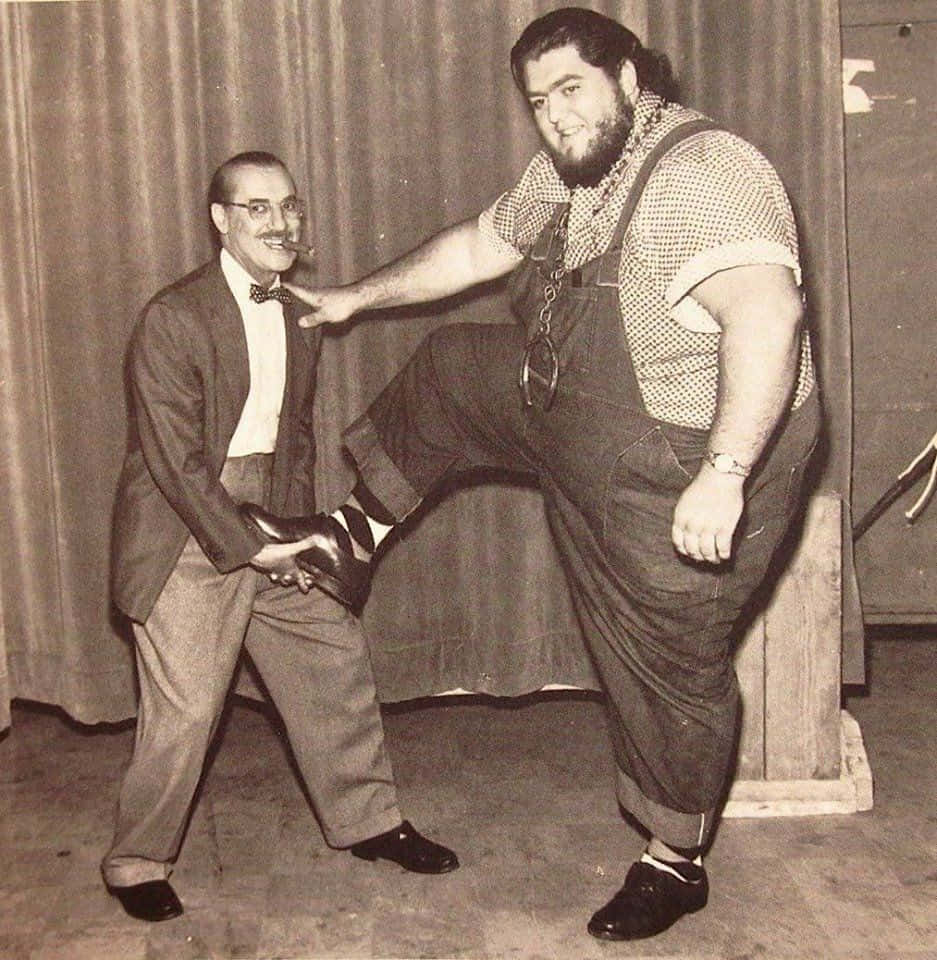 American Professional Wrestler Haystacks Calhoun With Comedian Groucho Marx Wallpaper