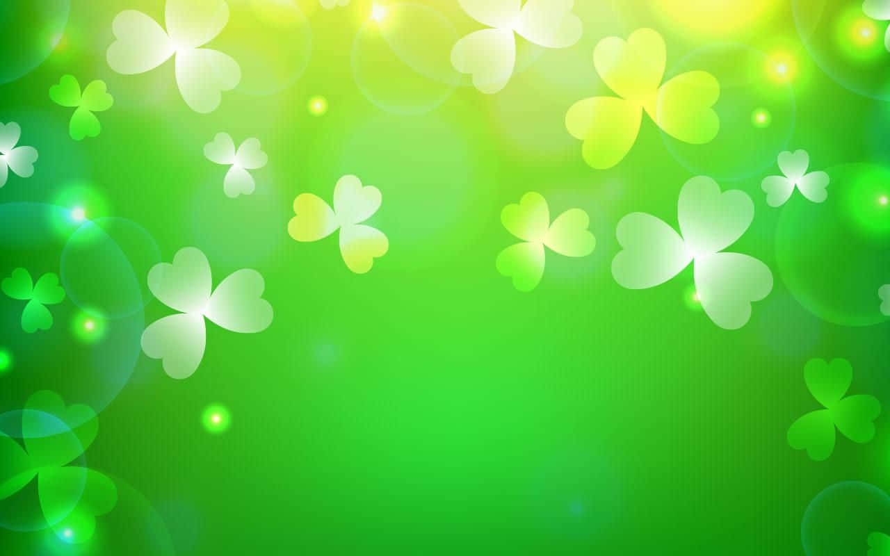 An Emerald Green Shamrock Lies Atop A White Surface Wallpaper