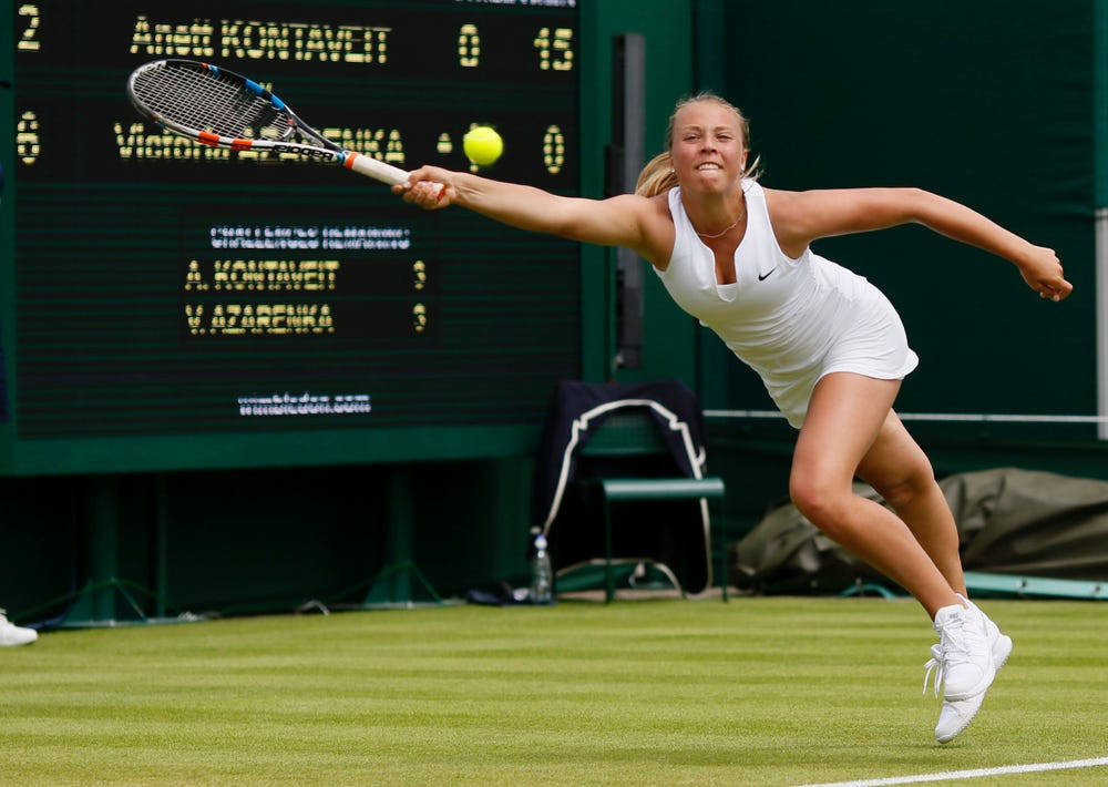 Anett Kontaveit Reaching Out For Ball Wallpaper