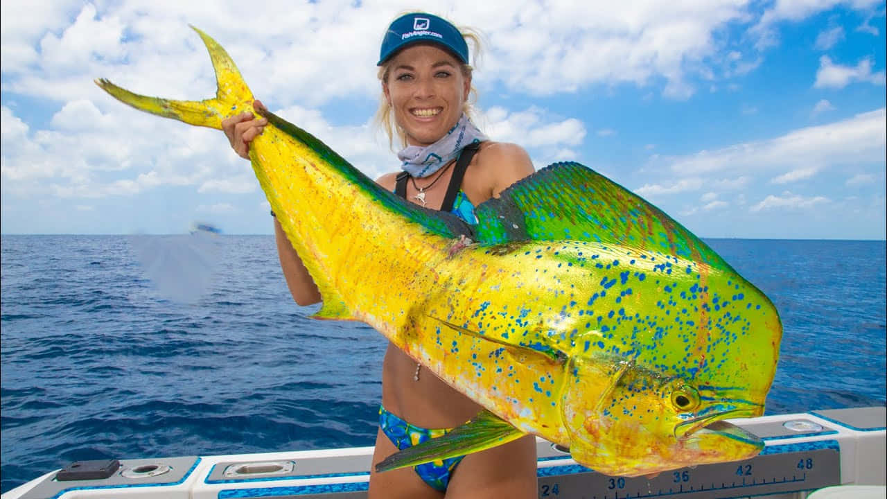 Anglerwith Caught Mahi Mahi Wallpaper