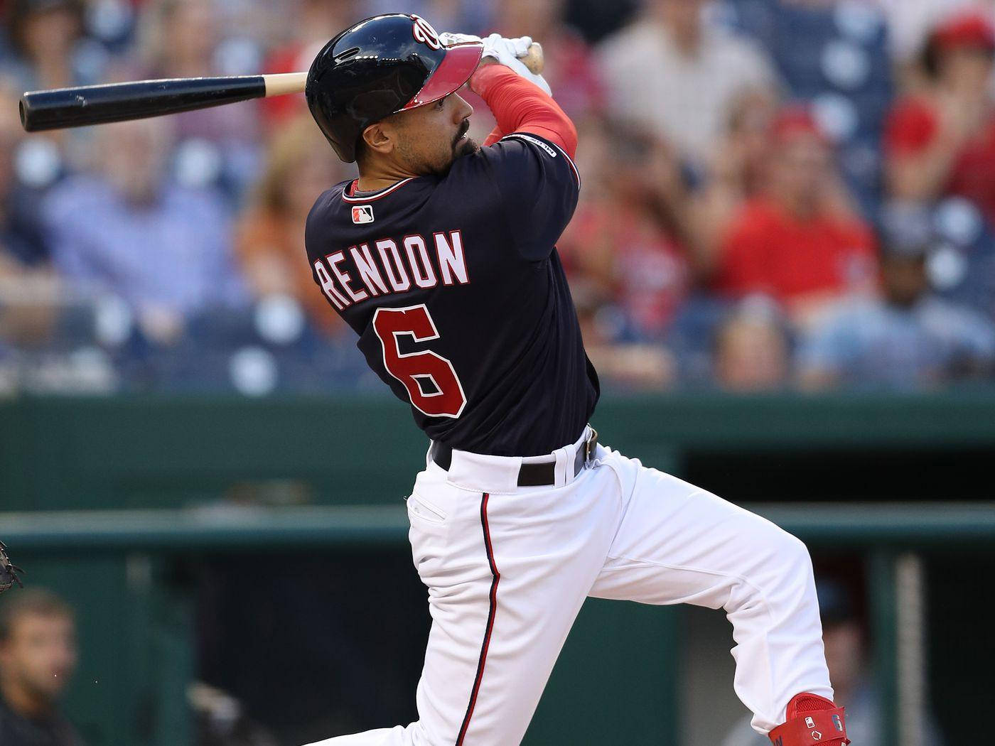 Anthony Rendon Swinging Bat In Dark Blue Wallpaper