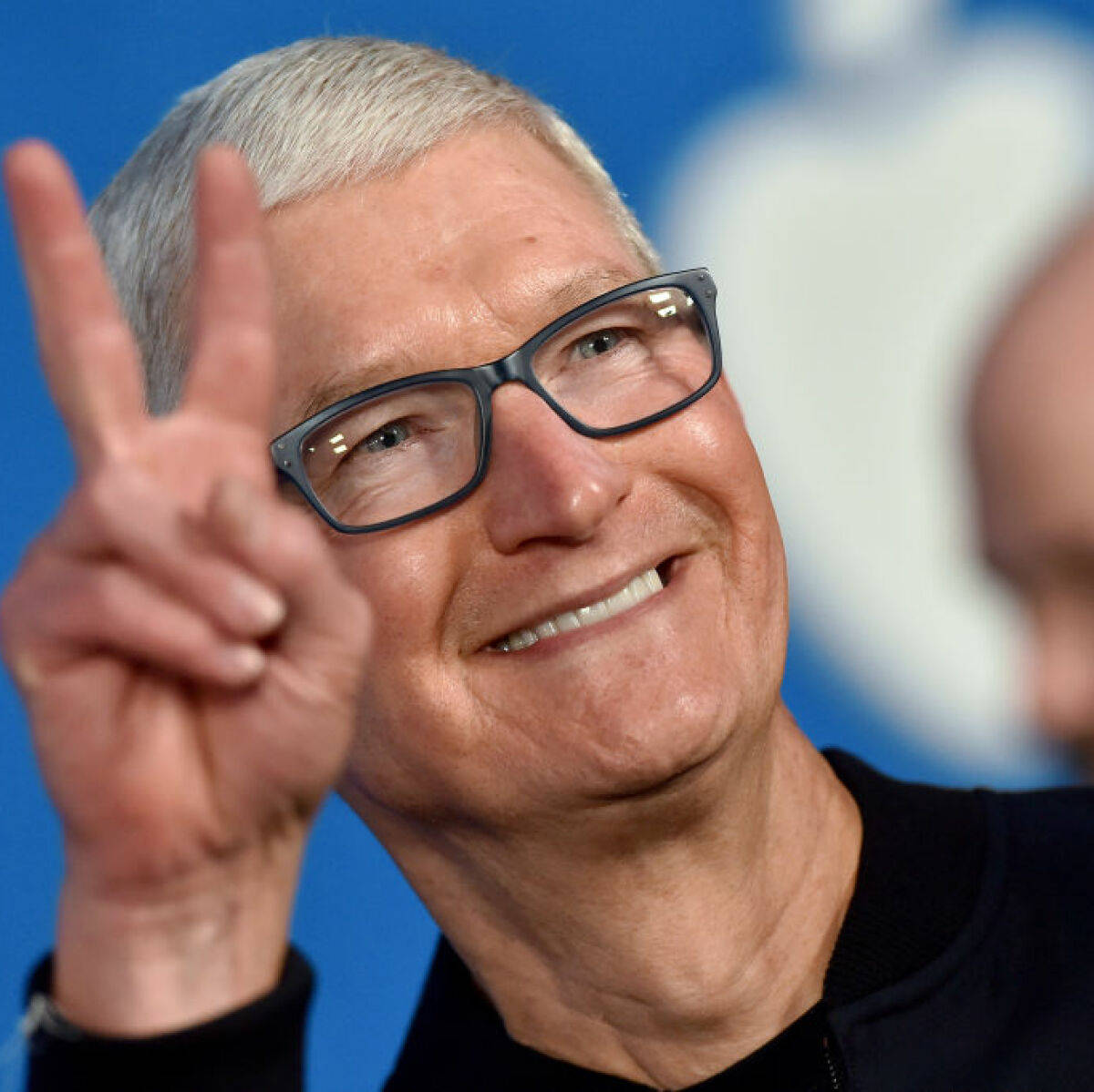 Apple Ceo Tim Cook Delivering A Keynote Speech At A Conference Wallpaper