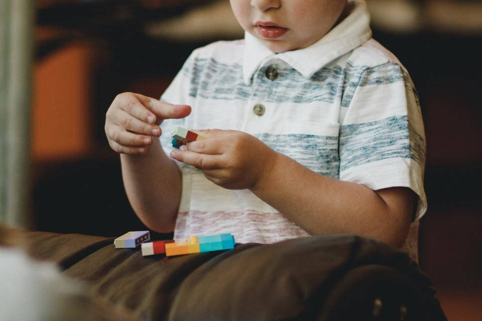 Baby Boy Playing With Lego Wallpaper